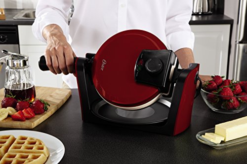 Oster DuraCeramic Red waffle maker being flipped by chef while on the counter