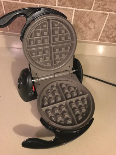 Presto FlipSide Ceramic Belgian Waffle Maker Open and on the counter
